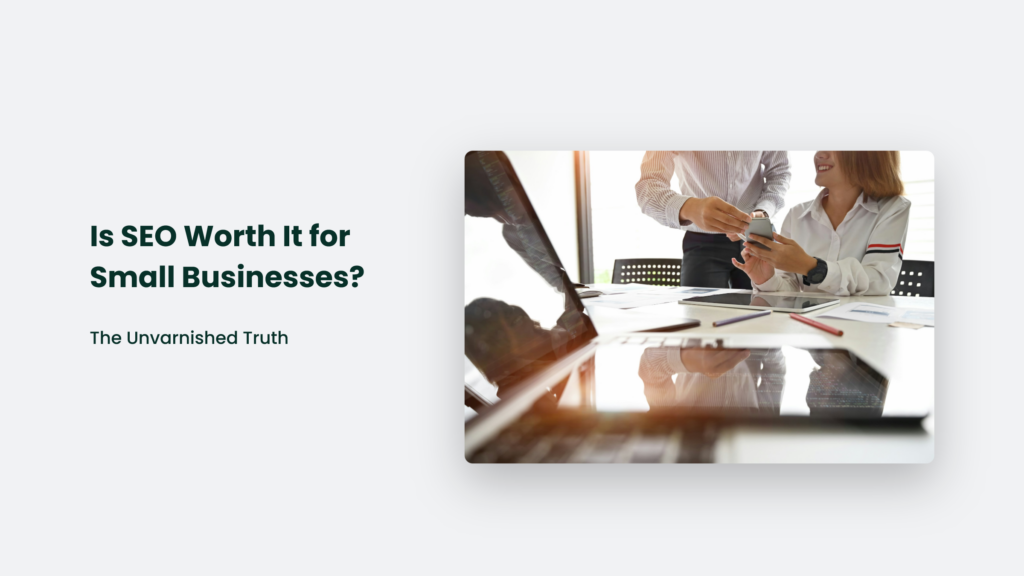 In A Bustling Office, Two Colleagues Discuss Over A Smartphone Amid Documents And A Laptop. Text Reads: &Quot;Is Seo Worth It For Small Businesses? Discover The Unvarnished Truth.